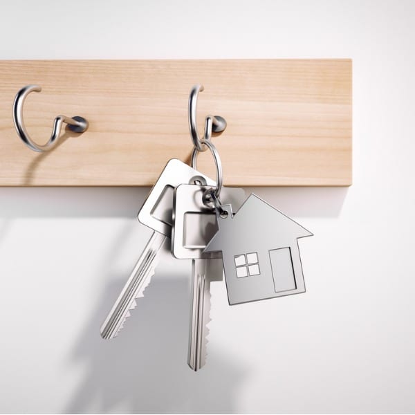 Hanging new house key with keyring
